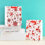 Load image into Gallery viewer, Merry charismas with reindeer and stars stylish paper-bag for gifting. - TinyBo
