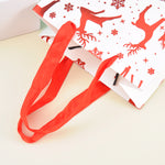 Load image into Gallery viewer, Merry charismas with reindeer and stars  stylish paper-bag for gifting.
