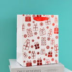 Load image into Gallery viewer, Merry charismas with reindeer and stars  stylish paper-bag for gifting.
